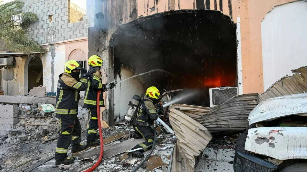 Bahrain says debris from intercepted Iranian drones injures child, damages homes